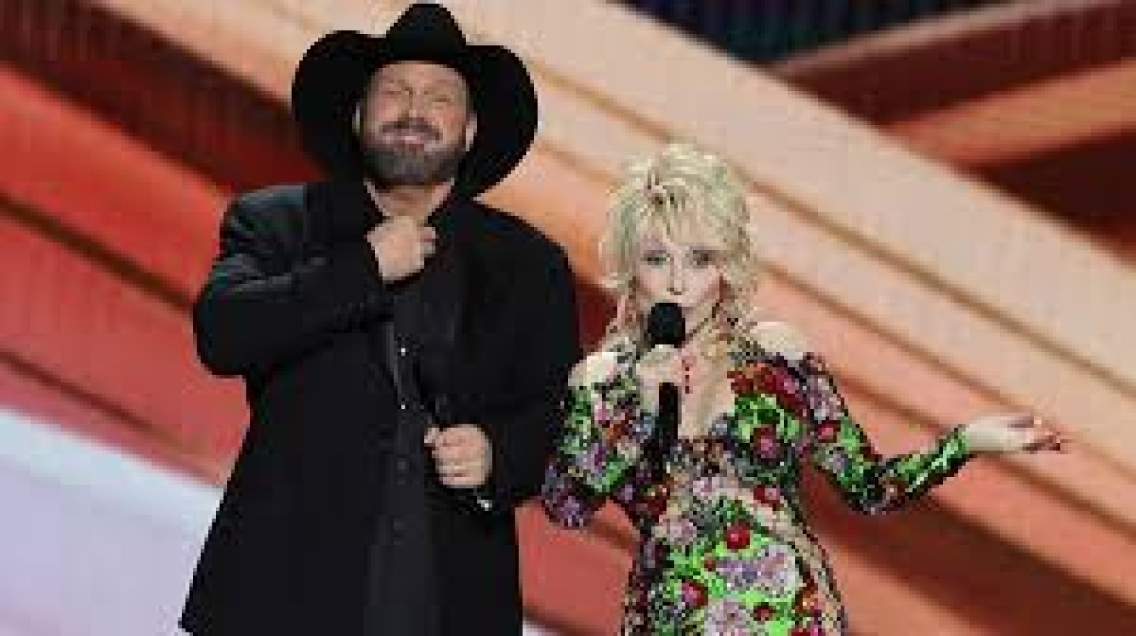 ACMs host Dolly Parton’s threesome joke makes Garth Brooks blush